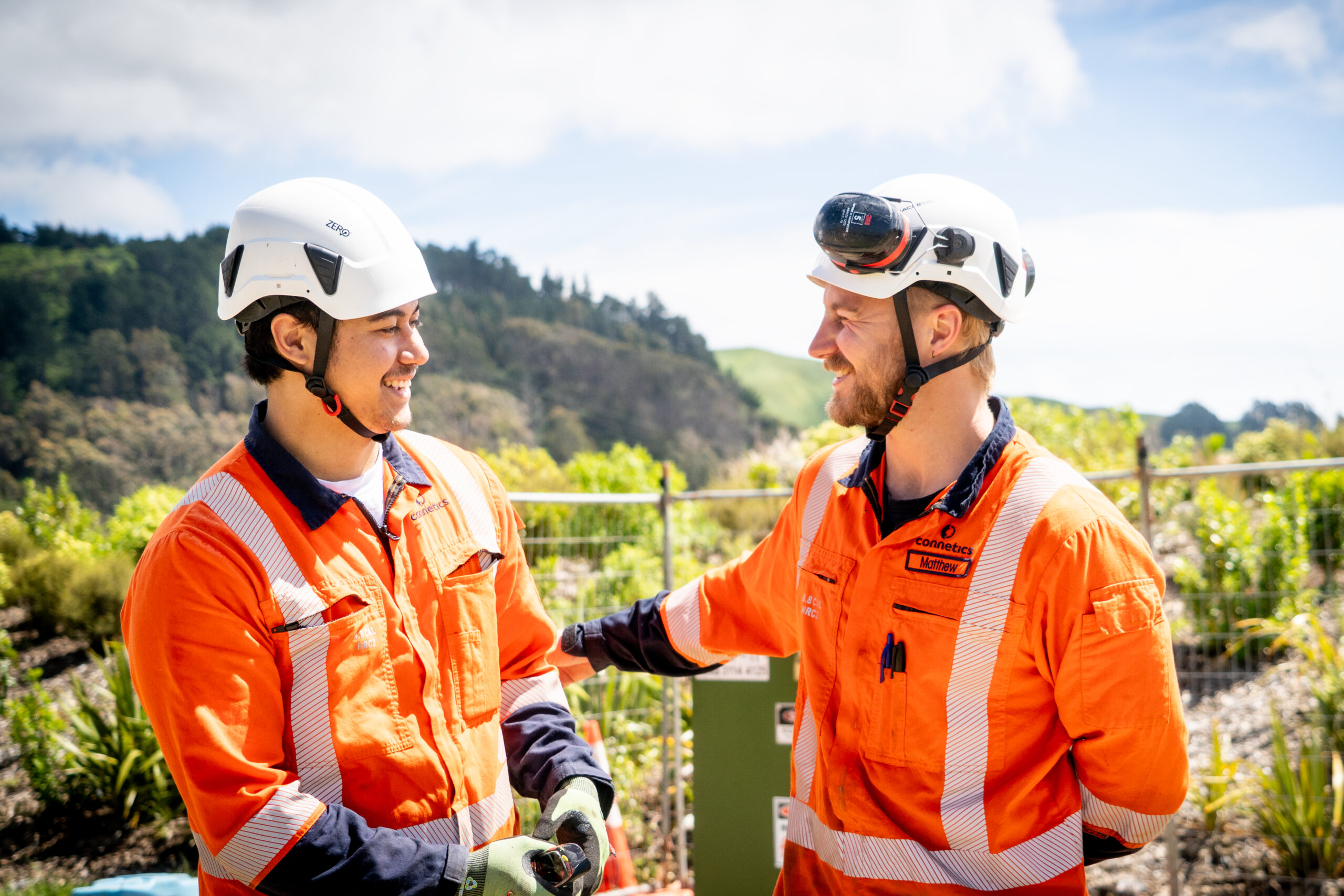 two employees laughing