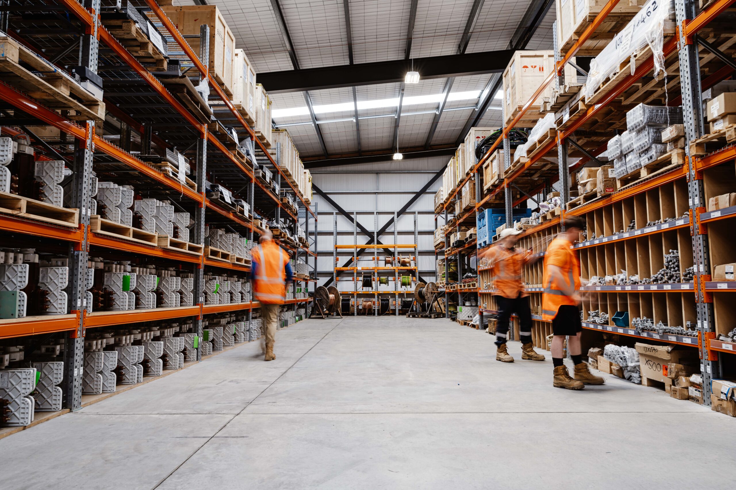 Warehouse with materials and people.