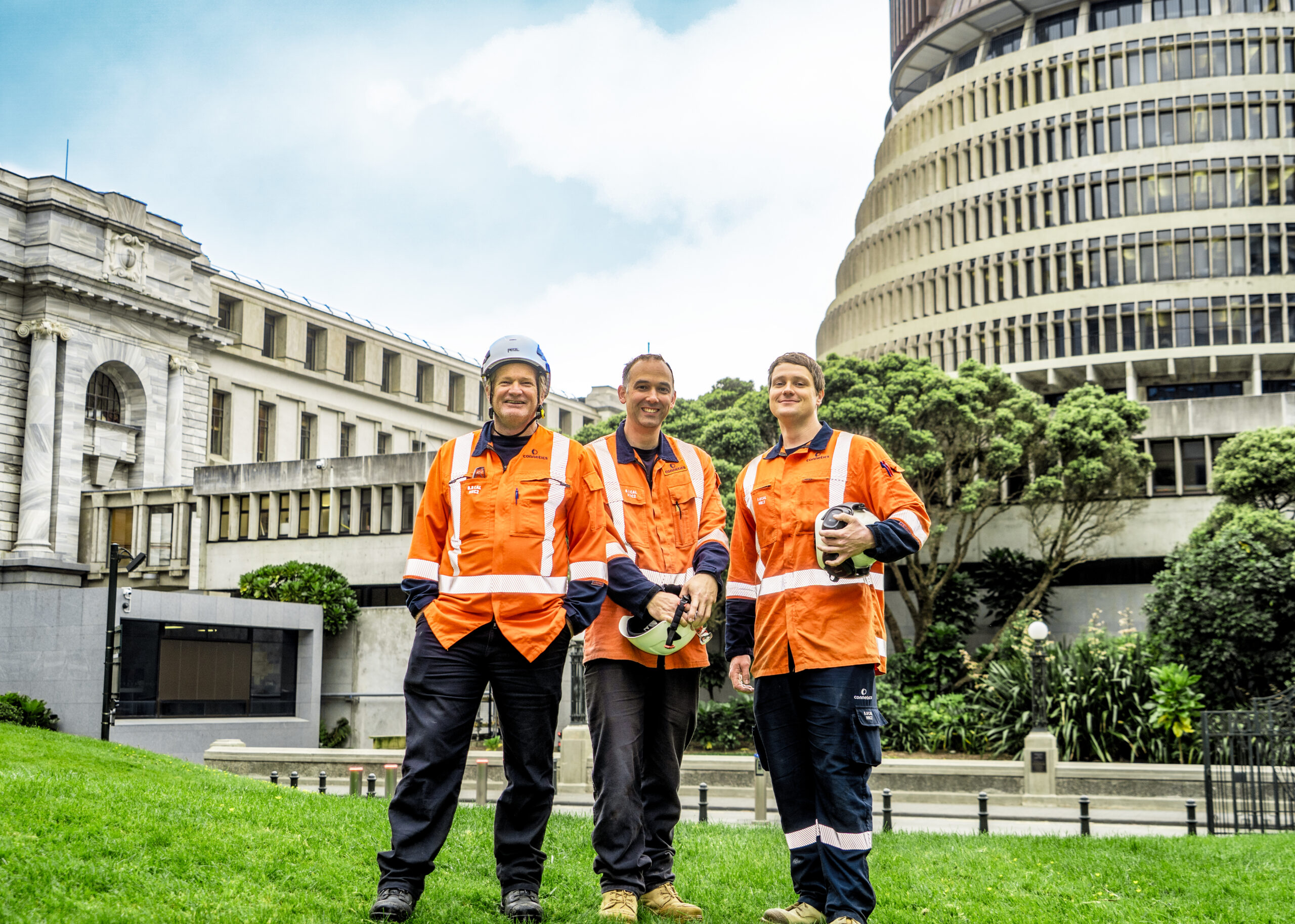 Team in front of Beehive Wellington