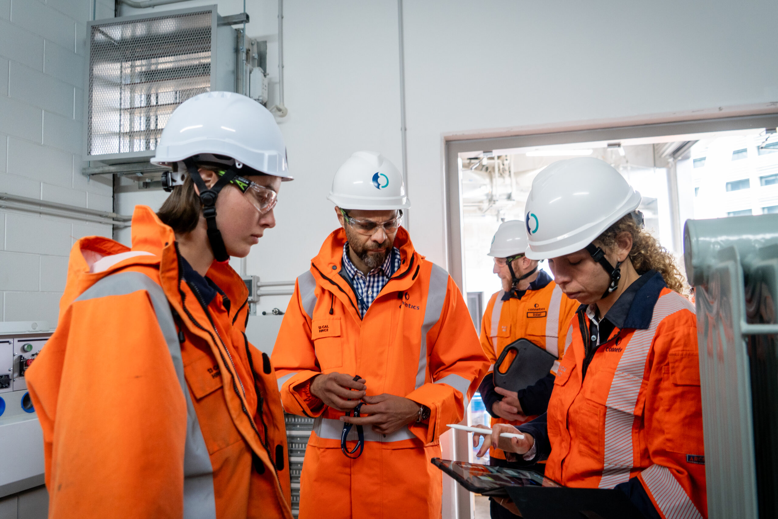 Workers looking at screen