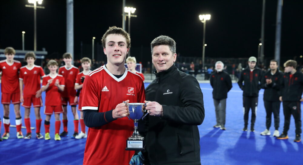 Hockey player receiving trophy