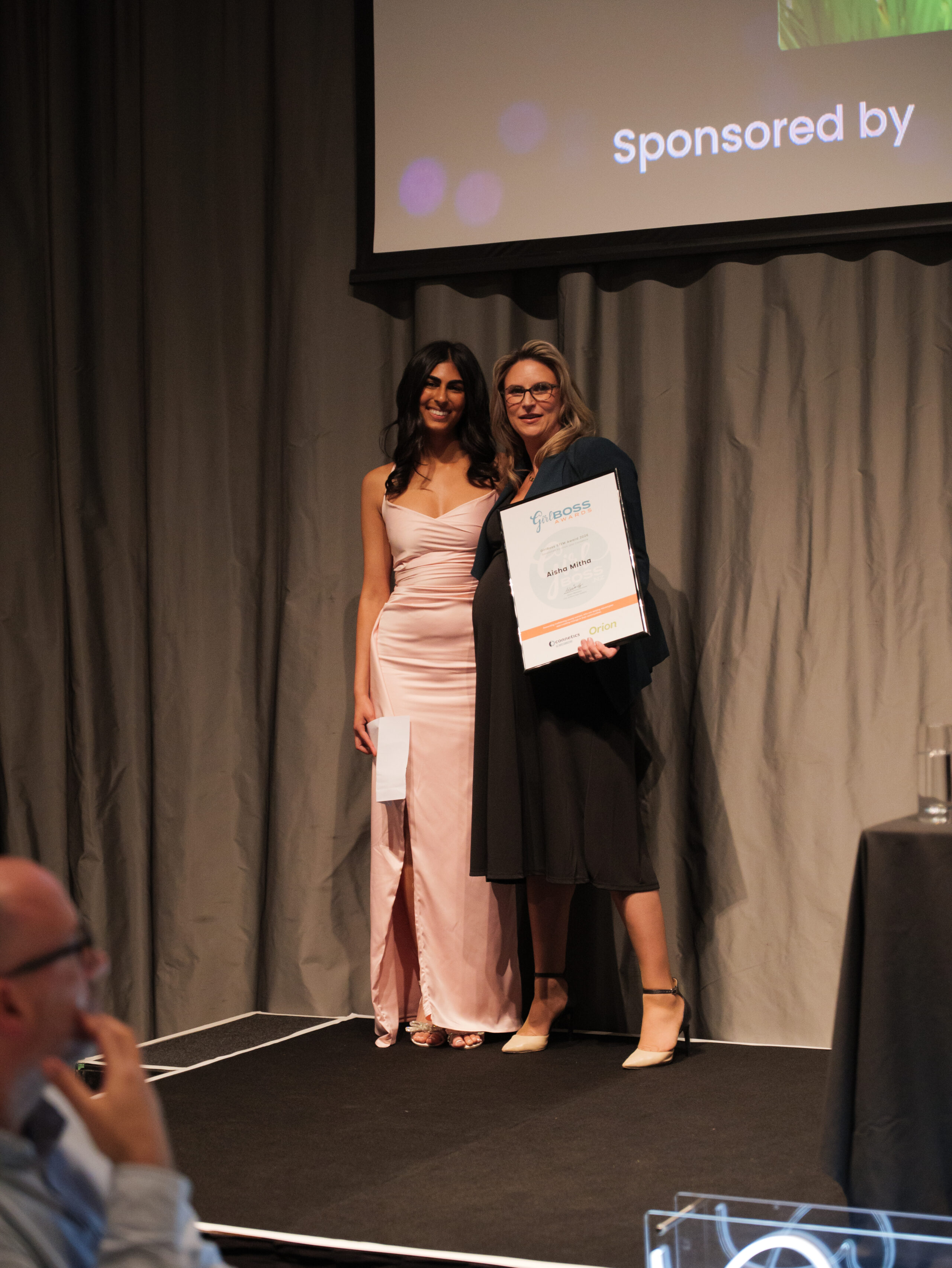 National GirlBoss 2026 STEM Winner Aisha Mitha Winner presented her award by Connetics' Natasha Smith